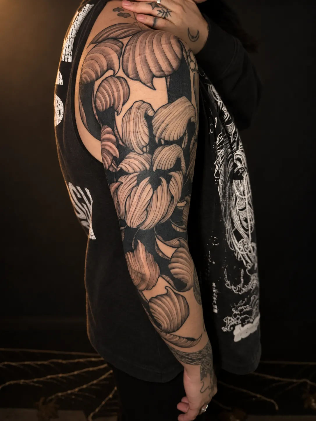 Black and grey chrysanthemum sleeve following the full arm